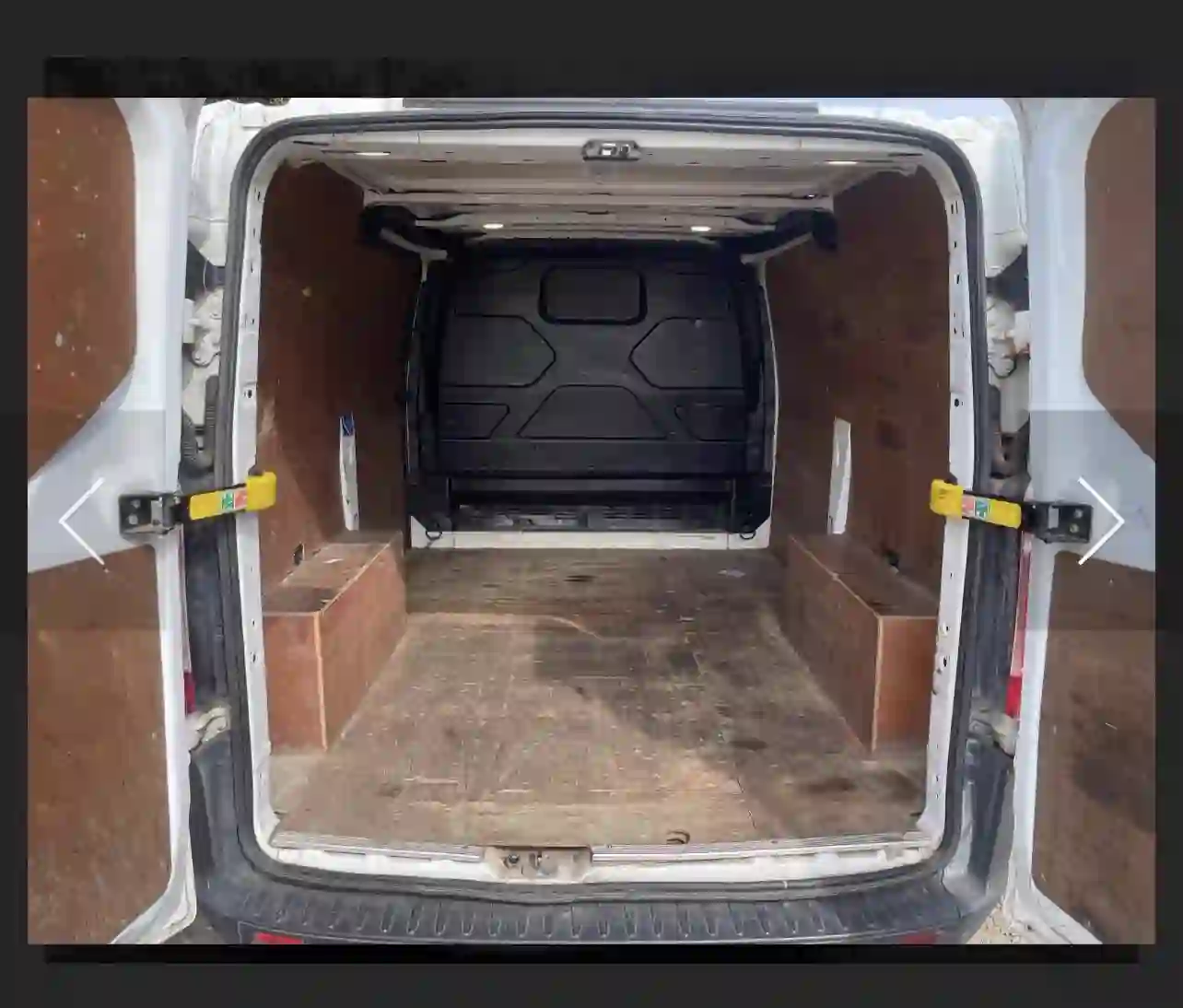 Man and van load space — rear doors open showing full-height ply-lined cargo area