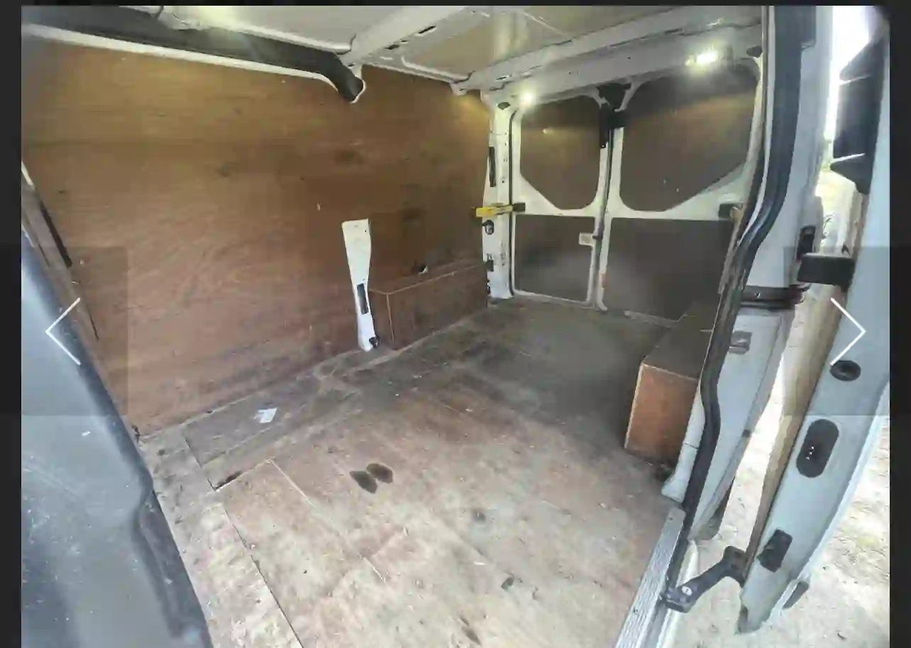 Man and van interior load space — side view showing full cargo depth and tie points